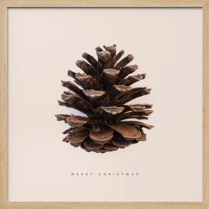 A minimalist art print featuring a single brown pinecone centered on an off-white background. The words 'MERRY CHRISTMAS' are printed in a simple, spaced-out font below the pinecone. The entire image is enclosed in a light wood frame. Artwork