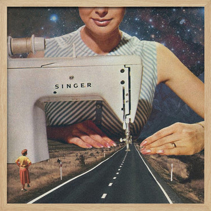 A surreal collage in a light wood frame featuring a giant woman in a striped dress using a vintage Singer sewing machine to stitch the white dashed lines onto an empty road that stretches into the distance. The background behind the woman is a starry galaxy, and a small woman in vintage clothing stands on the side of the road looking on. Print