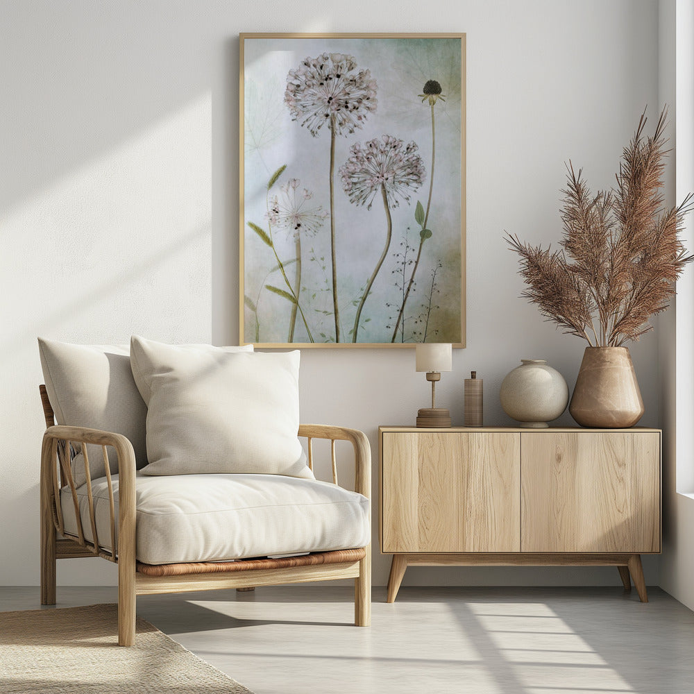 A framed botanical artwork featuring a variety of delicate wildflowers, including several large, round, light pink allium heads with dark centers, on long slender stems against a pale, textured green and beige background. Decor
