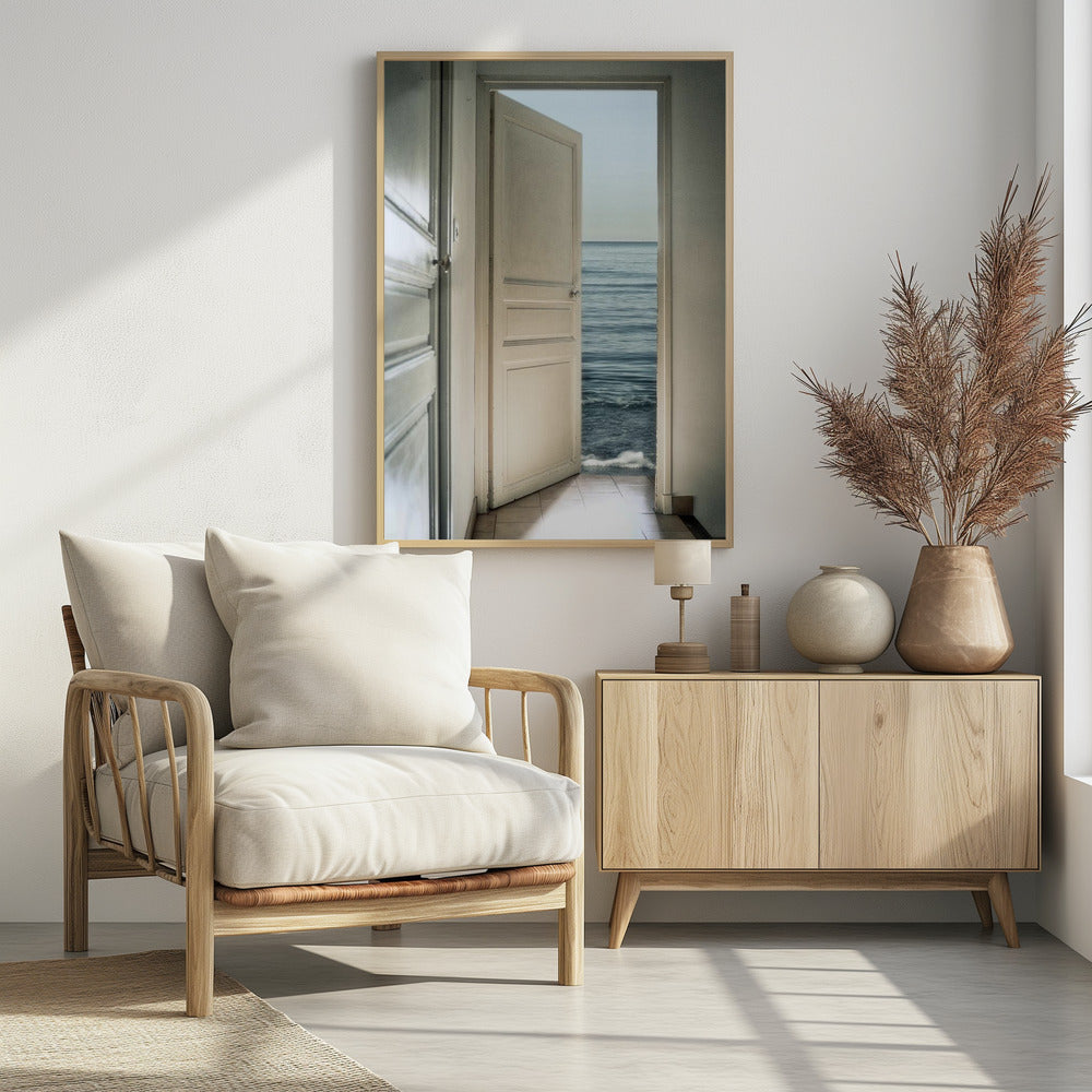 A surreal photograph showing a white interior door swung open, revealing not a landscape but the vast blue ocean, with waves gently washing over the tiled floor of the room. Decor