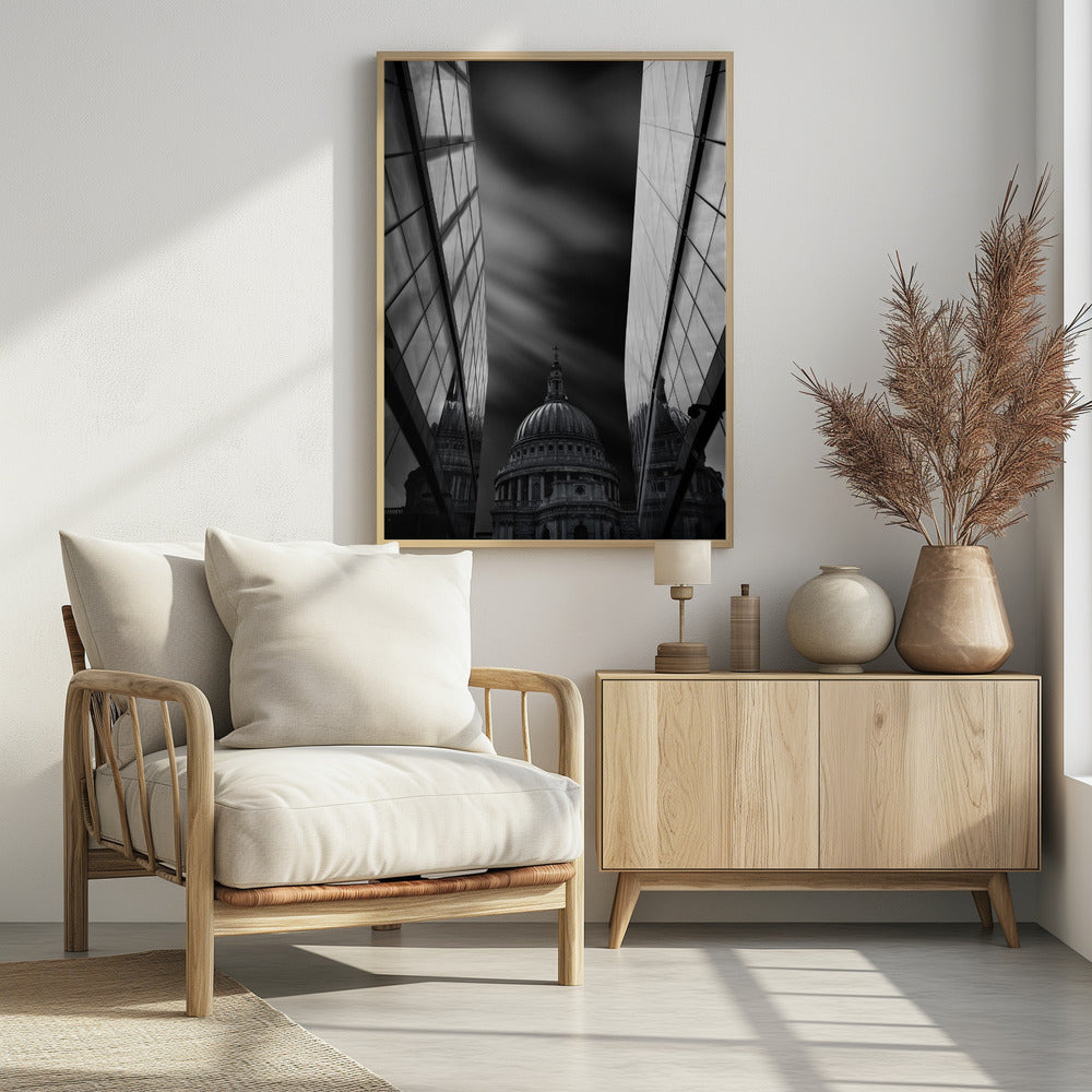 A dramatic black and white, low-angle photograph of St. Paul's Cathedral in London, framed between two modern, reflective glass skyscrapers. A long exposure effect blurs the clouds in the sky, creating streaks of light and shadow behind the cathedral's dome. Poster