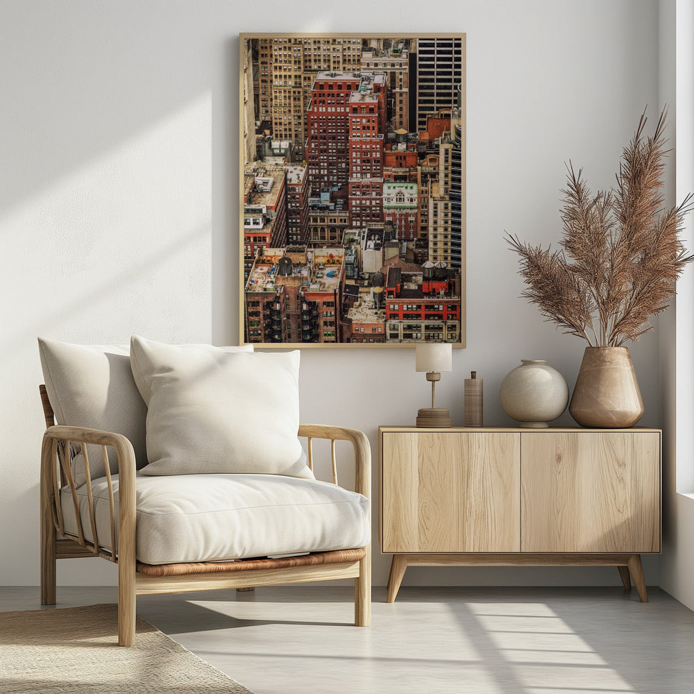 A high-angle, telephoto view of a dense cluster of New York City buildings, featuring a mix of red and brown brick architecture, with numerous windows creating a geometric pattern and several classic wooden water towers perched on the rooftops. Print