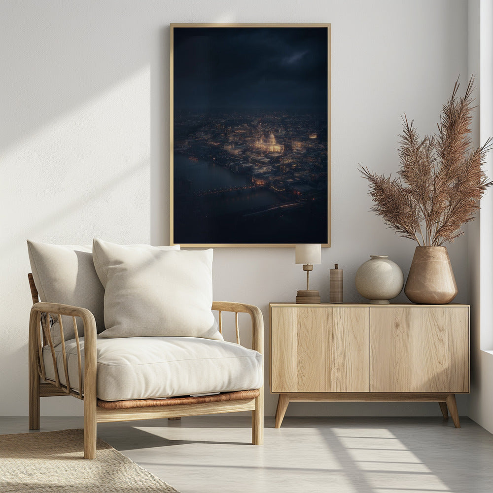 An atmospheric aerial view of London at night, with the illuminated St. Paul's Cathedral as the central focus. The sprawling cityscape glows with warm lights against a dark, stormy sky, while the River Thames flows in the foreground. Wall Art