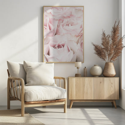 A close-up, soft-focus photograph of a bouquet of delicate, light pink roses filling the entire frame, enclosed in a simple black border. Poster