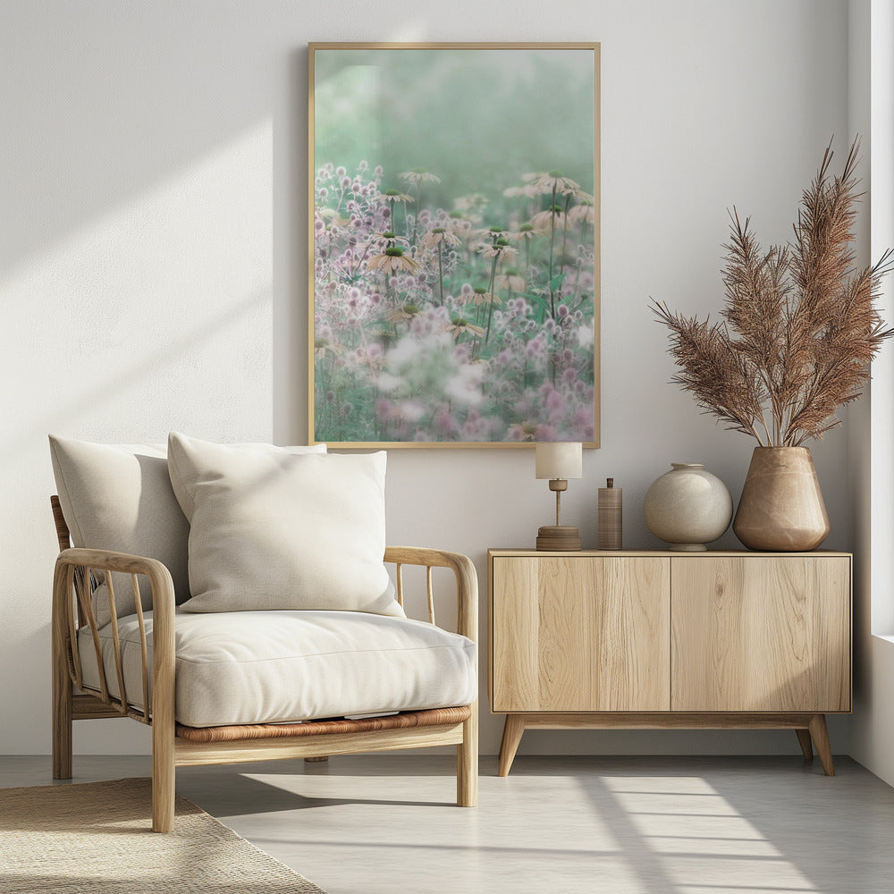A soft-focus, dreamy photograph of a field of wildflowers, including pale coneflowers with green centers and fuzzy pink thistles, set against a hazy, light green background, creating an ethereal and serene atmosphere. The image is shown within a thin black frame. Poster
