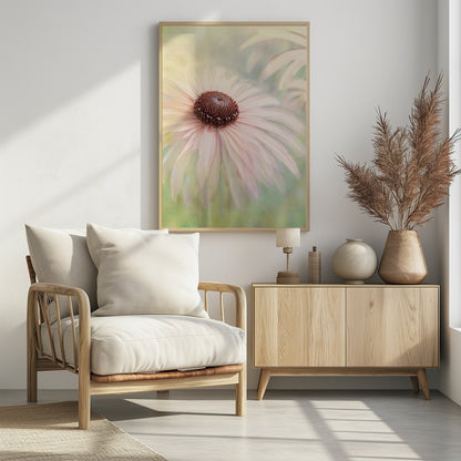 A soft-focus, artistic closeup of a pale pink coneflower with a prominent dark brown, textured center. The background is a dreamy, painterly blend of soft greens and yellows, giving the image an ethereal quality. Wall Art