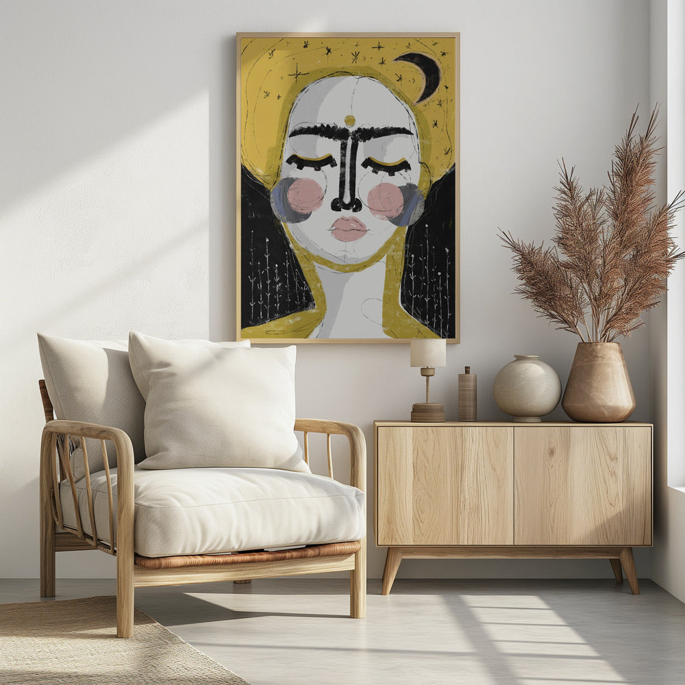 An abstract, framed painting of a serene face with closed eyes. The face is rendered in white with pink blush on the cheeks and bold, black lines for the unibrow and nose. A golden dot adorns the forehead. The background is a vibrant mustard yellow featuring a black crescent moon and simple star sketches. Wall Art