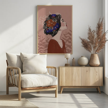 An illustrative portrait of a woman in profile with her head tilted back and eyes closed. Her dark, curly hair is adorned with vibrant orange, blue, and small white flowers. She is wearing a rust-colored top against a dusty pink background with a faint leaf pattern. Print