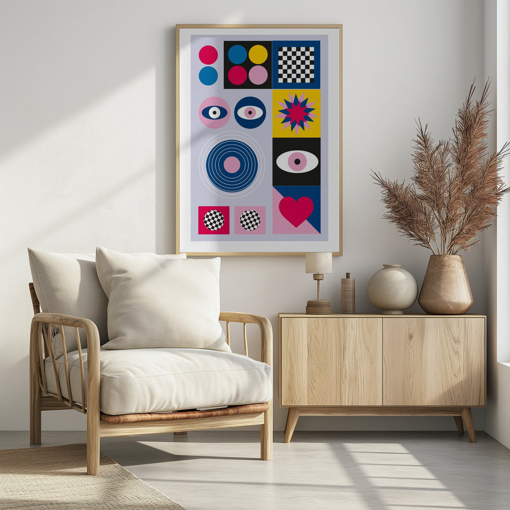 A modern abstract art print in a black frame, featuring a grid of colorful geometric shapes and symbols on a light blue background. The composition includes pink, blue, and yellow circles, a black and white checkerboard pattern, stylized eyes, concentric rings, a starburst, and a large pink heart. Wall Art
