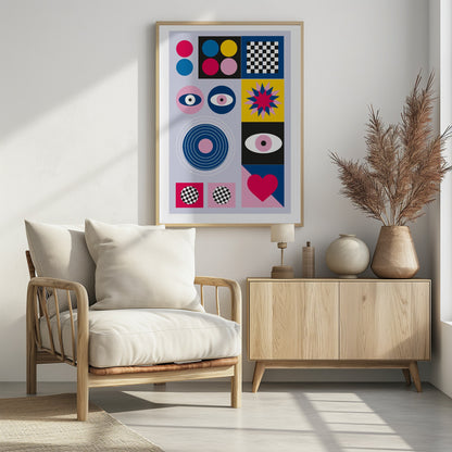 A modern abstract art print in a black frame, featuring a grid of colorful geometric shapes and symbols on a light blue background. The composition includes pink, blue, and yellow circles, a black and white checkerboard pattern, stylized eyes, concentric rings, a starburst, and a large pink heart. Wall Art