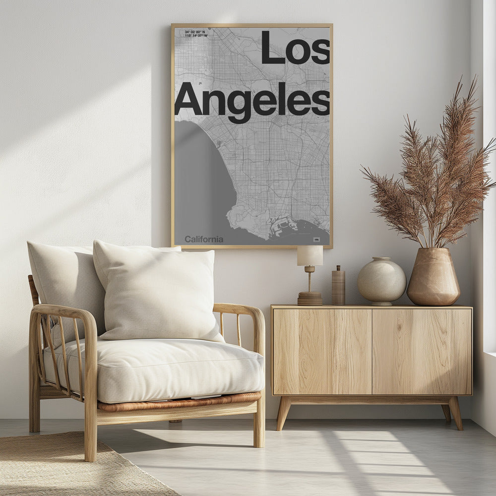 A minimalist black and white framed map of Los Angeles. The poster features a detailed street grid of the city and its coastline. The words 'Los Angeles' are overlaid in a large, bold, black sans-serif font. In the top-left corner are the coordinates, and in the bottom-left is the word 'California'. Decor