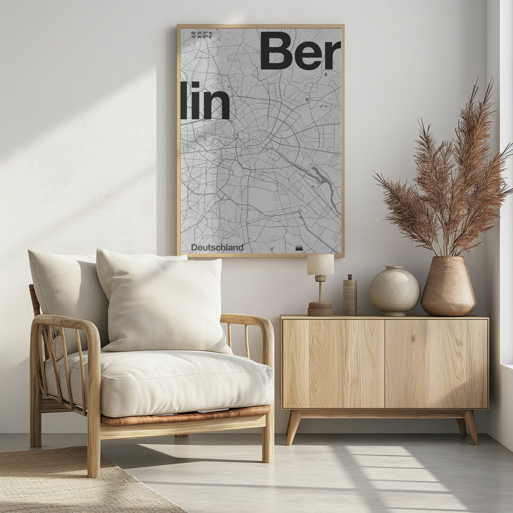 A minimalist, framed poster of a street map of Berlin, Germany. The map is rendered in shades of gray, with large, bold black text spelling 'Berlin' overlaid on the map. The city's coordinates and the word 'Deutschland' are also included in a clean, modern font. Wall Art