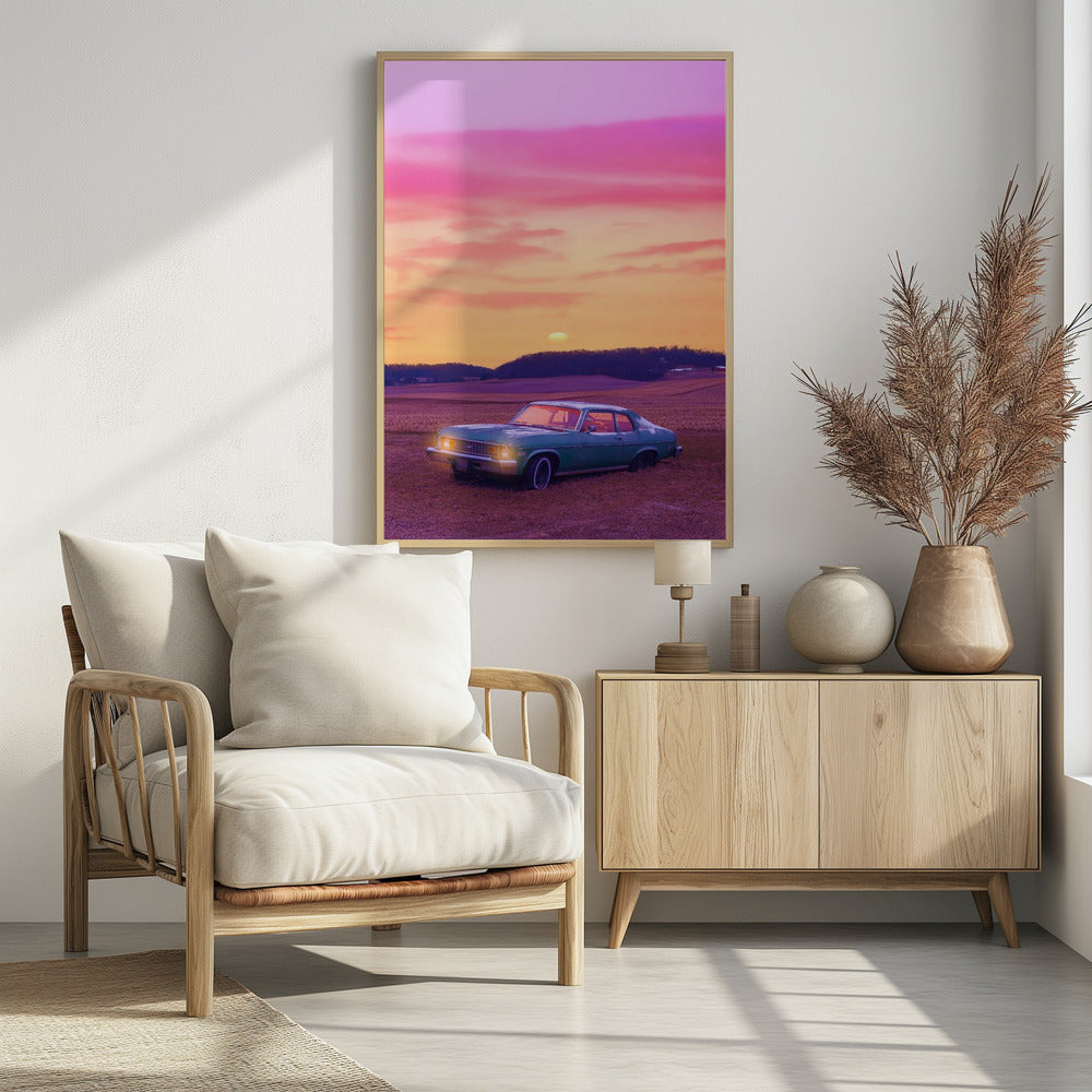 A vintage green muscle car is parked in a purple-hued field under a vibrant sunset sky that blends from orange to a vivid pink. The car's headlights are glowing, and the sun is setting behind distant hills, creating a dreamy, retro atmosphere. Decor