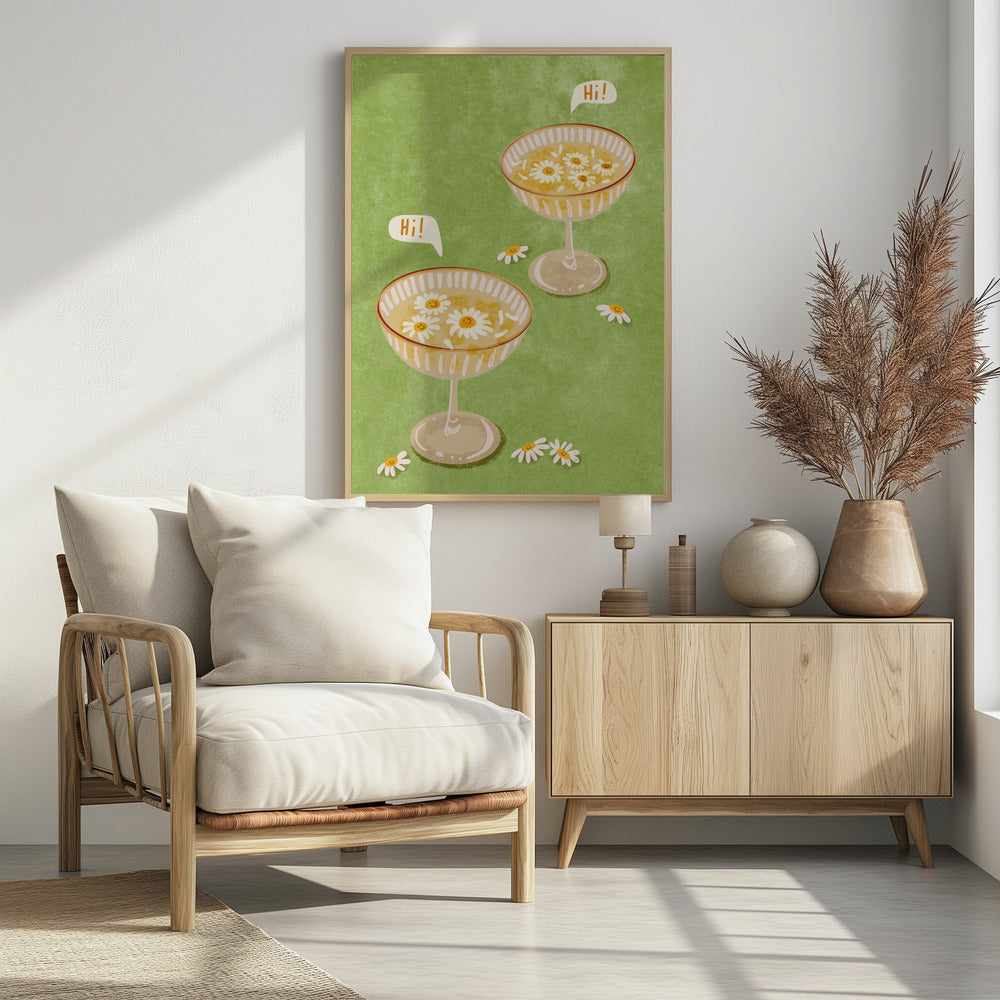 A whimsical illustration featuring two cocktail coupe glasses on a light green background. The glasses are filled with a yellow liquid and have smiling white daisies floating in them. Two speech bubbles say 'Hi!', adding a friendly and cheerful vibe to the scene. Wall Art