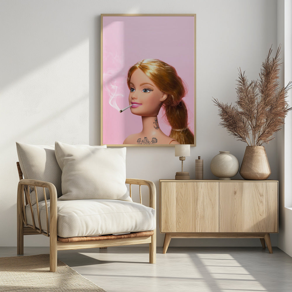 A close-up photograph of a blonde doll, resembling Barbie, with tattoos on her neck and chest, smoking a joint against a solid pink background. Smoke curls upwards from the lit cigarette in her pink-lipsticked mouth. Artwork