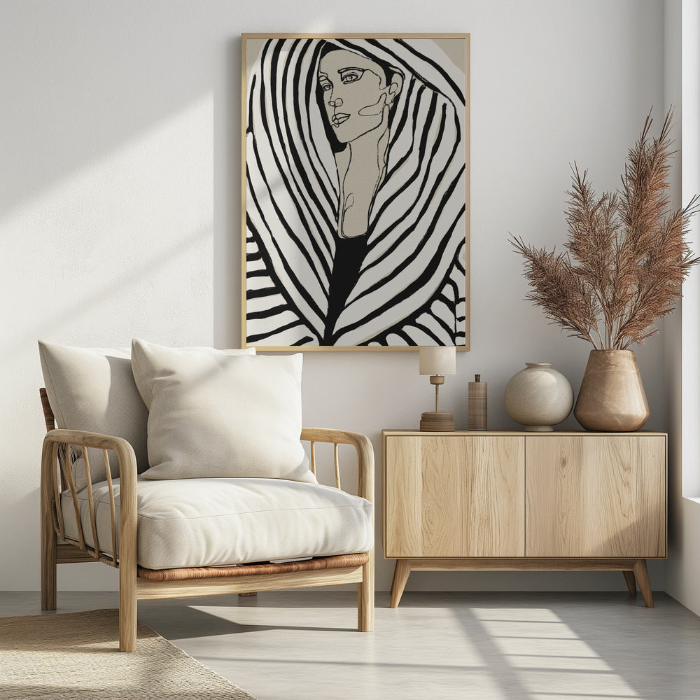 A modern, framed line art portrait of a woman. Her face is rendered in simple black outlines on a beige background, and she is wrapped in a voluminous garment with bold, graphic black and off-white stripes, creating a zebra-like pattern. Wall Art