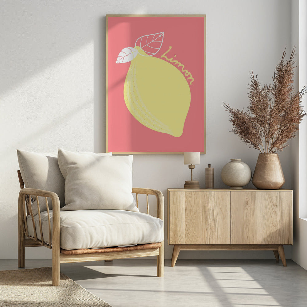 A stylized illustration of a large yellow lemon on a solid pink background. The lemon has two white-outlined leaves, and the word 'Limon' is written in cursive script across the fruit. The artwork is enclosed in a thin black frame. Print