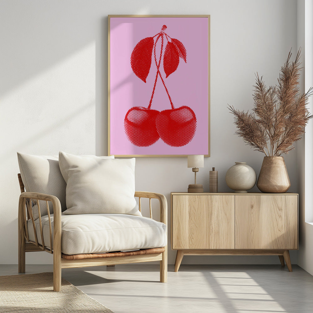 A pop art style print of two bright red cherries with stems and leaves, rendered in a halftone dot pattern against a solid light pink background, enclosed in a simple black frame. Wall Art