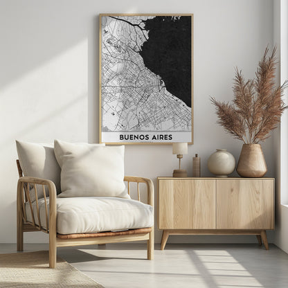 A minimalist black and white map of Buenos Aires, presented as a poster in a black frame. The city's roads and geography are detailed in black lines on a white background, while the adjacent body of water is solid black. The text 'BUENOS AIRES' is displayed at the bottom. Wall Art