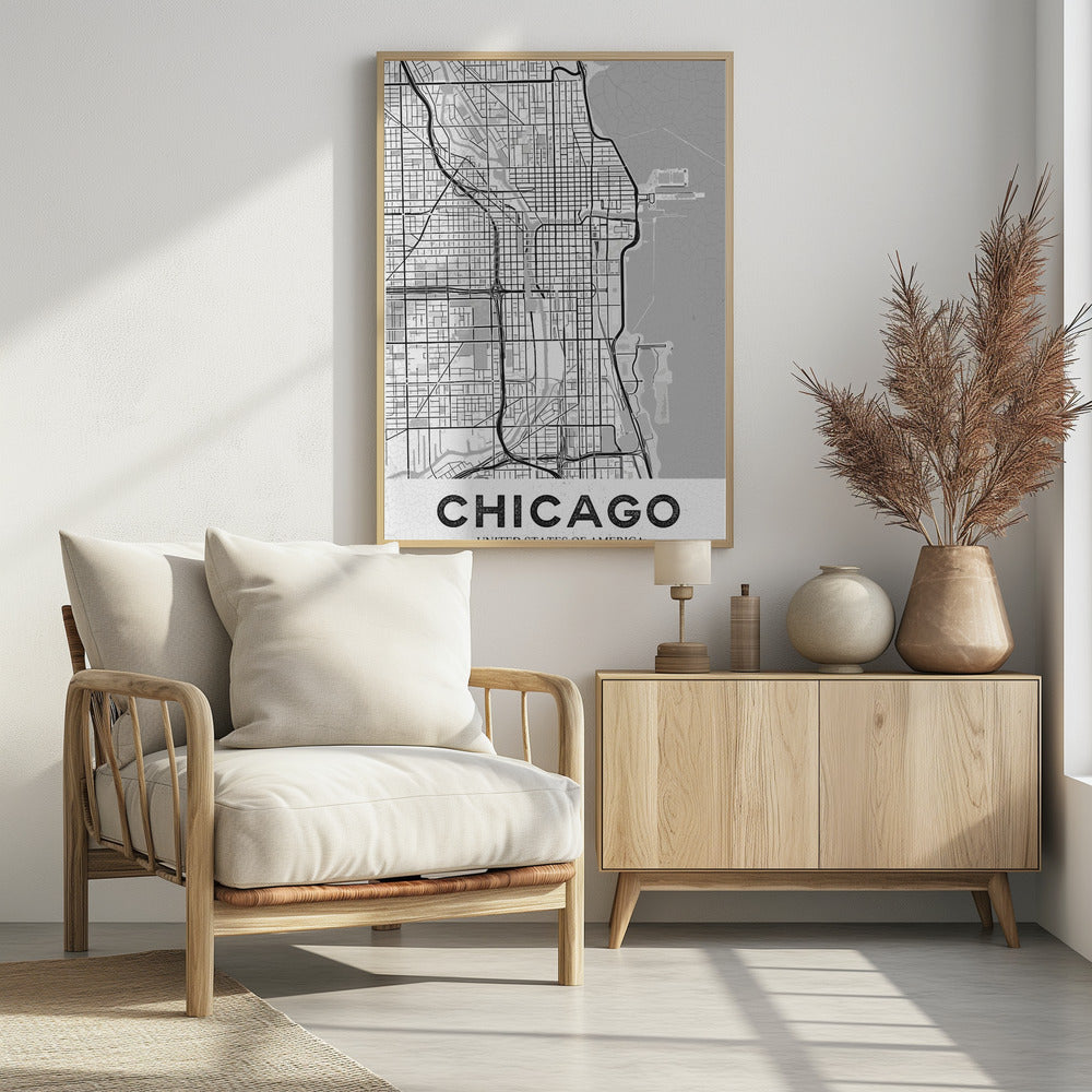 A minimalist black and white map of Chicago, presented vertically. The map shows the city's grid system, highways, and waterways, with Lake Michigan to the right. The word 'CHICAGO' is in a bold, sans-serif font at the bottom, all enclosed within a thin black frame. Poster