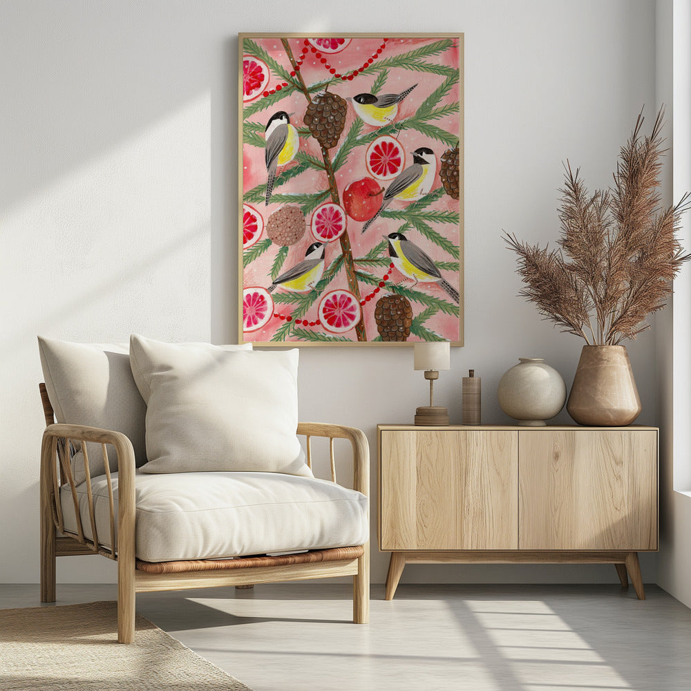 A festive illustration of a pine branch against a pink background, decorated with chickadees, pinecones, slices of red grapefruit, a red apple, and a red beaded garland. The scene has a light dusting of snow, creating a whimsical winter or holiday feel. Decor