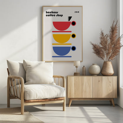 A minimalist Bauhaus-style poster titled 'bauhaus coffee shop 1919'. The artwork features a vertical stack of three stylized coffee cups in primary colors—red, yellow, and blue—on a light cream background, all rendered in simple geometric shapes. Poster