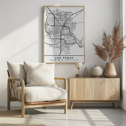 A minimalist black and white framed map of Las Vegas, showcasing the city's street grid and major highways. Below the map, the city's name and geographical coordinates are printed in a clean, modern font. Poster