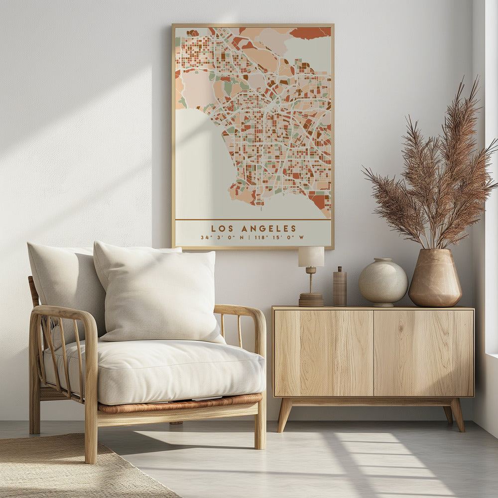 A stylized, block-pattern map of Los Angeles in a warm, earthy color palette of terracotta, brown, and sage green on a cream background. The poster is framed in black and includes the text 'LOS ANGELES' with its geographic coordinates at the bottom. Print