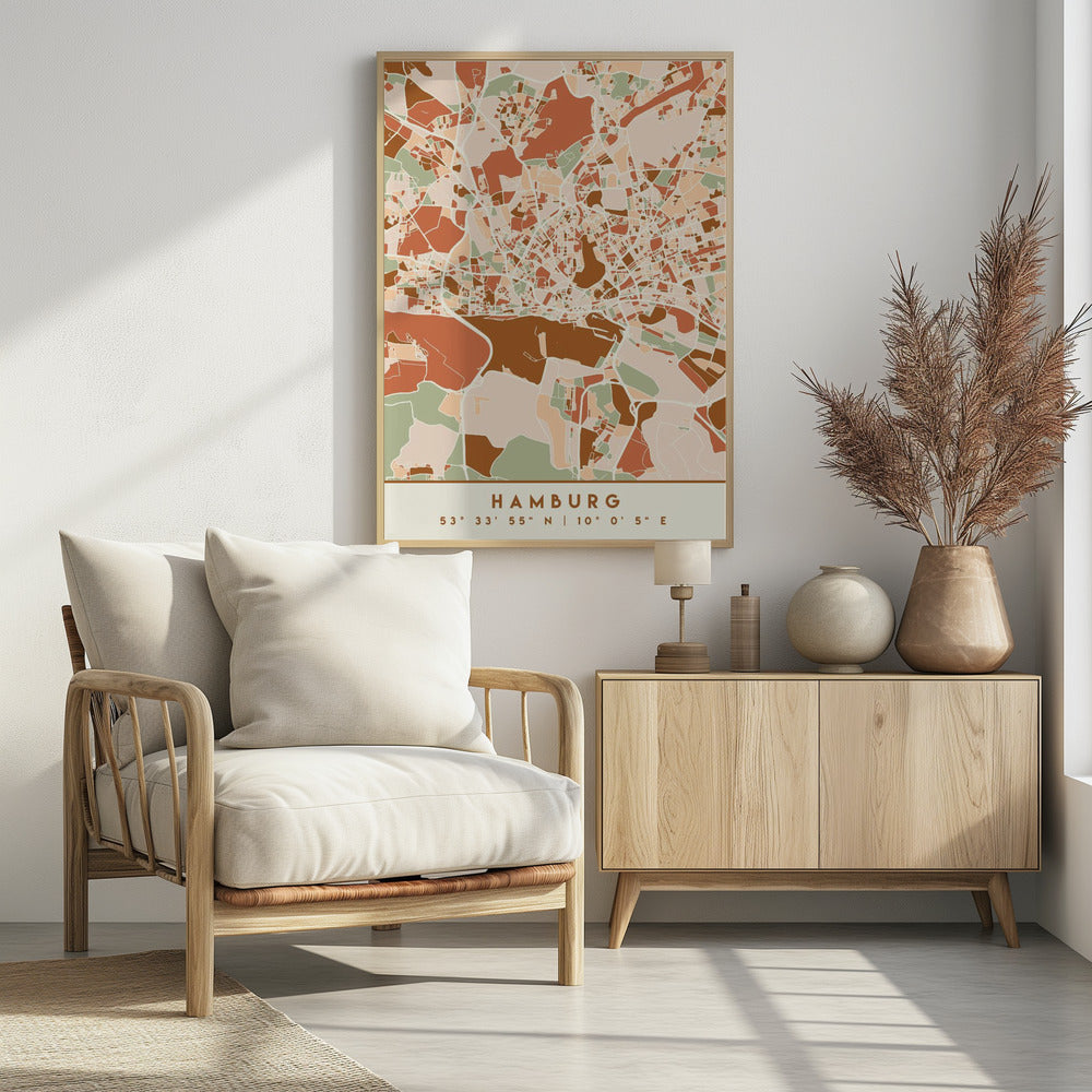 A modern, stylized art print of a Hamburg city map, featuring an abstract pattern of streets and neighborhoods in a color palette of terracotta, brown, sage green, and cream. The bottom of the print has a cream border with the city's name 'HAMBURG' and its geographical coordinates. The artwork is presented in a thin black frame. Wall Art