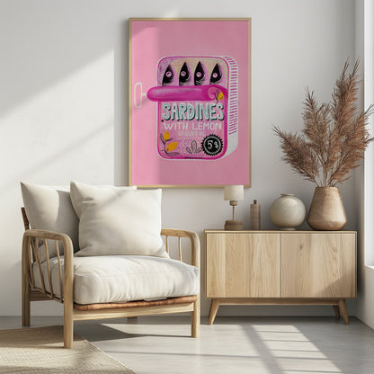 A pop art style illustration of an open can of sardines against a bright pink background. The can itself is pink with text that reads 'SARDINES WITH LEMON IN OLIVE OIL', and it contains four stylized fish. The artwork is presented in a simple black frame. Poster