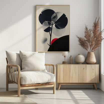 A modern abstract artwork in a black frame featuring a stylized black tree against a cream background. The tree has large, overlapping leaves in solid black and stippled gray, creating a sense of transparency. A bold red circle, like a sun, rises behind a black silhouetted hill in the bottom right corner. Wall Art
