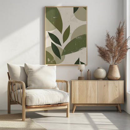 A framed abstract artwork featuring a collage of stylized leaf shapes in various shades of green, including olive and sage. The shapes overlap against a light beige background, and the entire piece has a distressed, textured finish with small black speckles. The composition is modern and botanical. Decor