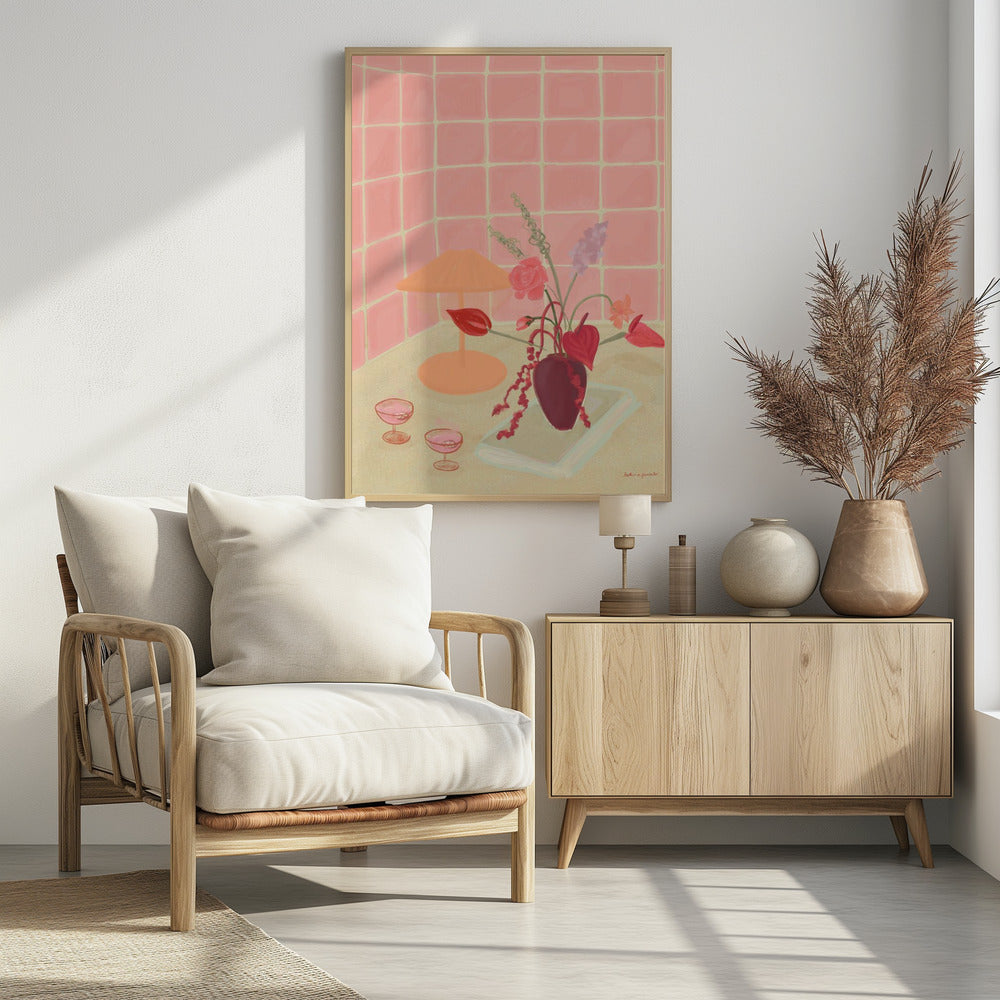 A painterly still life illustration of a countertop against a pink tiled wall, featuring a burgundy vase with an arrangement of red and pink flowers, an orange lamp, and two coupe glasses filled with a pink beverage. Poster