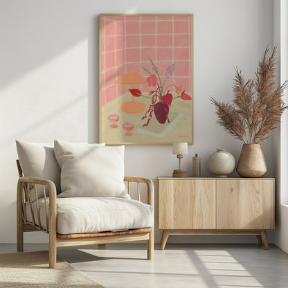 A painterly still life illustration of a countertop against a pink tiled wall, featuring a burgundy vase with an arrangement of red and pink flowers, an orange lamp, and two coupe glasses filled with a pink beverage. Poster