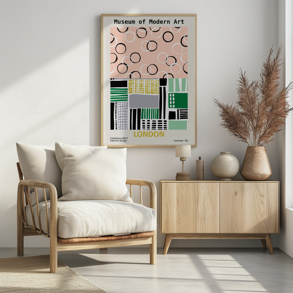 A retro-style exhibition poster for the Museum of Modern Art in London. The top half features scattered black and white circles on a pale pink background. The bottom half is an abstract geometric collage of shapes and patterns in green, yellow, black, and grey. Text at the bottom reads 'Exhibition #017 Interior design', 'LONDON', and 'Summer '69'. Print