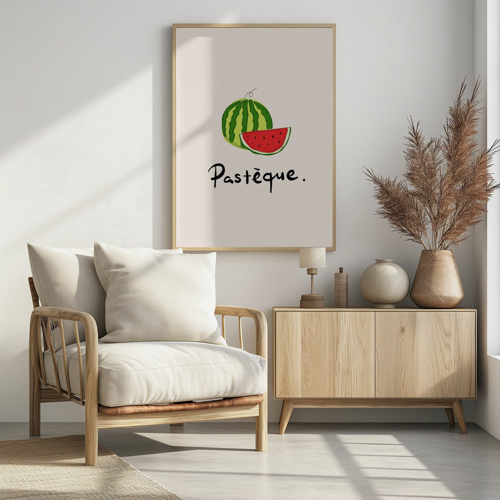 A framed art print featuring a simple, stylized illustration of a whole watermelon and a juicy red slice. Below the fruit, the French word 'Pastèque.' is written in black cursive script on a light cream background. Decor