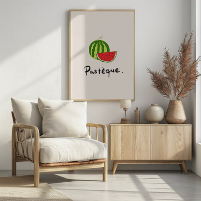 A framed art print featuring a simple, stylized illustration of a whole watermelon and a juicy red slice. Below the fruit, the French word 'Pastèque.' is written in black cursive script on a light cream background. Decor