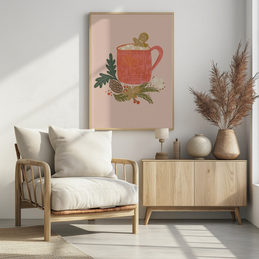 A charming holiday illustration of a red mug filled with hot chocolate and marshmallows, with a gingerbread man cookie peeking out. The mug sits on a bed of pine branches, a pinecone, and red berries, with another gingerbread man lying nearby, all against a solid light pink background. Wall Art