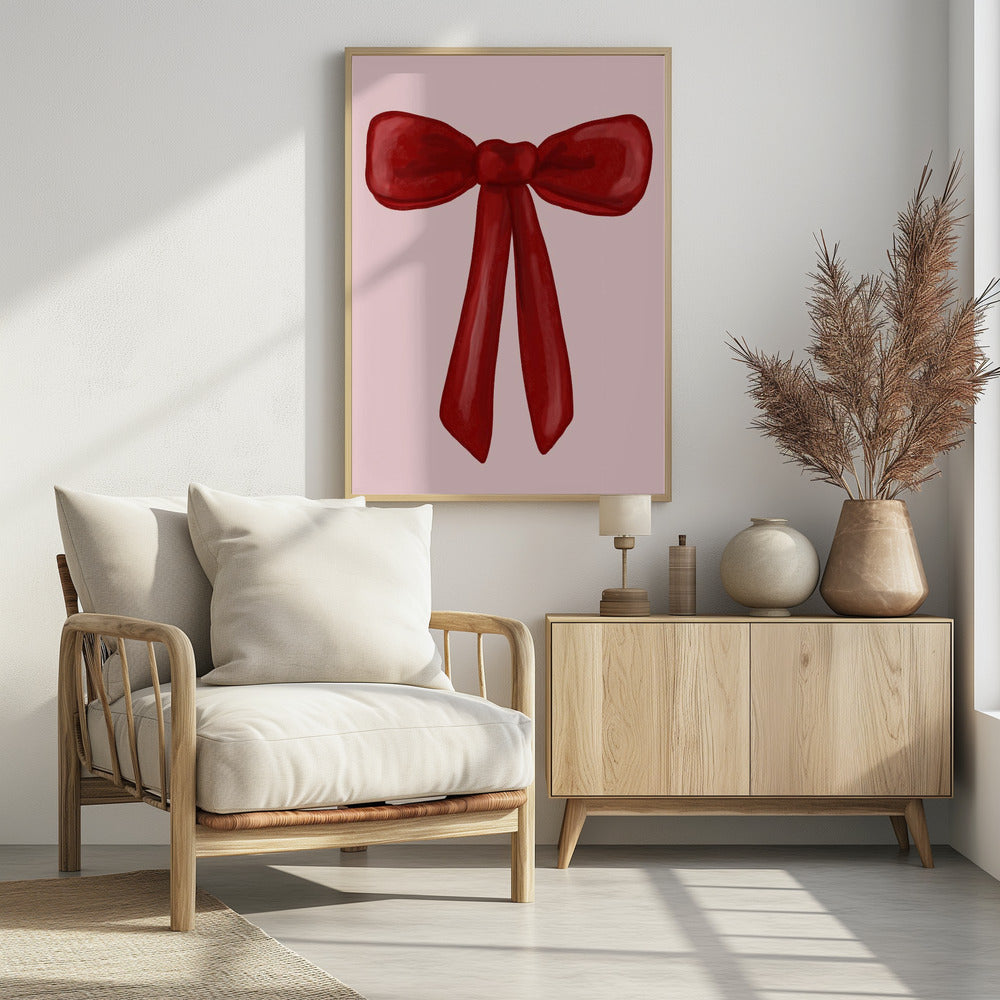 A digital painting of a large, shiny red ribbon tied into a bow, centered against a solid light pink background. The artwork is shown within a thin black frame. Print