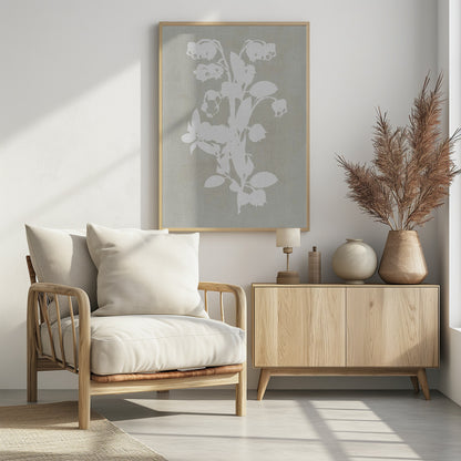 A minimalist botanical artwork in a black frame, showing a white silhouette of a Lily of the Valley stalk against a muted, textured grey-beige background. Wall Art