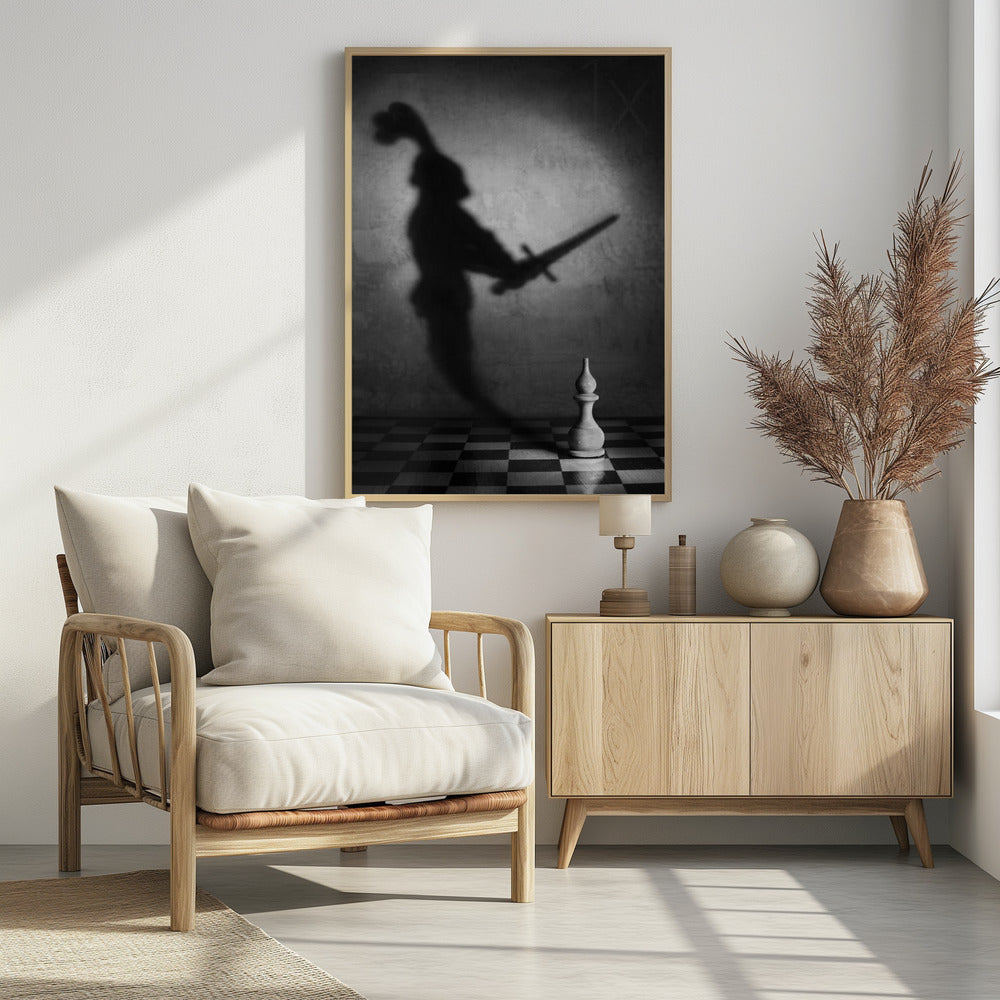 A black and white conceptual photograph of a single white chess piece on a checkerboard, casting a large, ominous shadow of a medieval knight holding a sword against a textured wall. Print