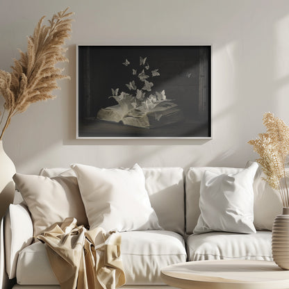 A conceptual artwork depicting an open vintage book on a dark wooden table. Dozens of butterflies, crafted from the book's own printed pages, are emerging and flying upwards as if the story is coming to life against a dark, rustic background. Artwork