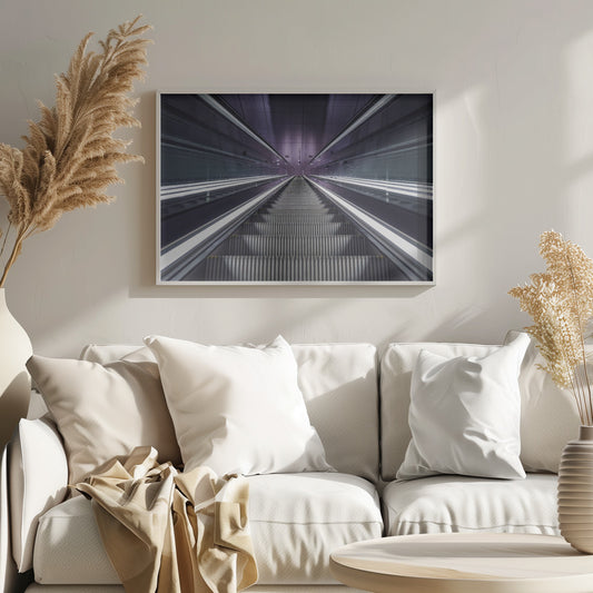 A symmetrical, first-person view looking down a long, empty escalator in a modern subway station, with bright white lights lining the handrails and a purple glow on the ceiling, creating a futuristic and infinite perspective. Wall Art