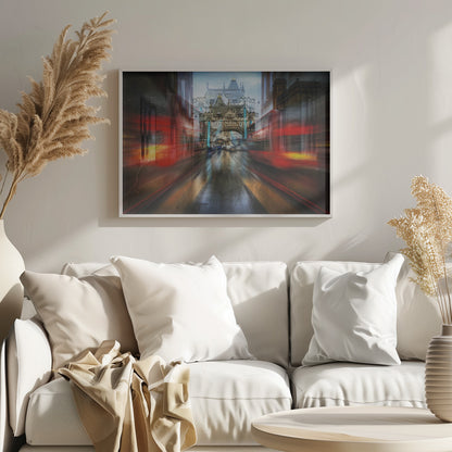 An abstract, motion-blurred digital art piece depicting a view of London's Tower Bridge down a wet street, framed by the red streaks of passing double-decker buses, creating a dynamic and rainy city atmosphere, all enclosed in a silver frame. Poster