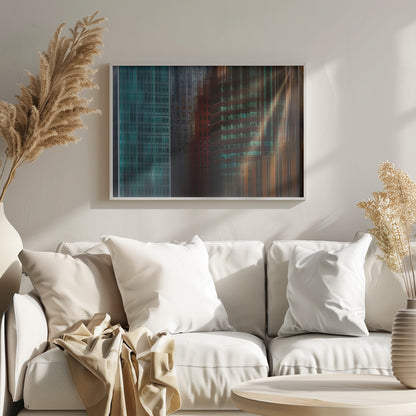 An abstract cityscape artwork in a silver frame, featuring a teal glass skyscraper on the left transitioning to red and brown buildings on the right with a strong vertical motion blur effect, creating a dynamic sense of movement. Decor