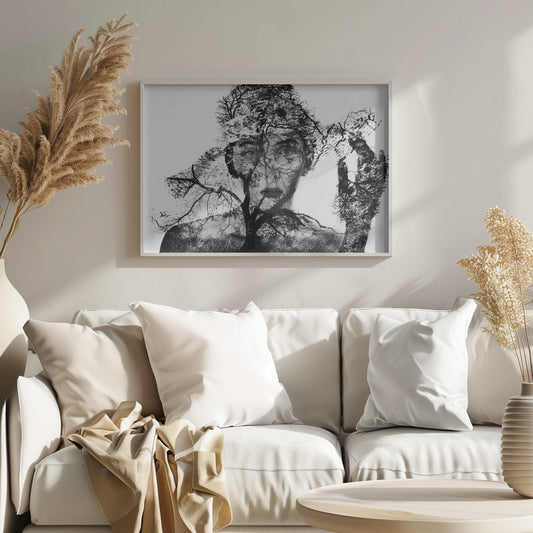 A surreal black and white double exposure artwork in a silver frame. The image combines a close-up portrait of a person's face with the intricate silhouette of bare, branching trees against a white background, creating a complex and thought-provoking visual. Poster