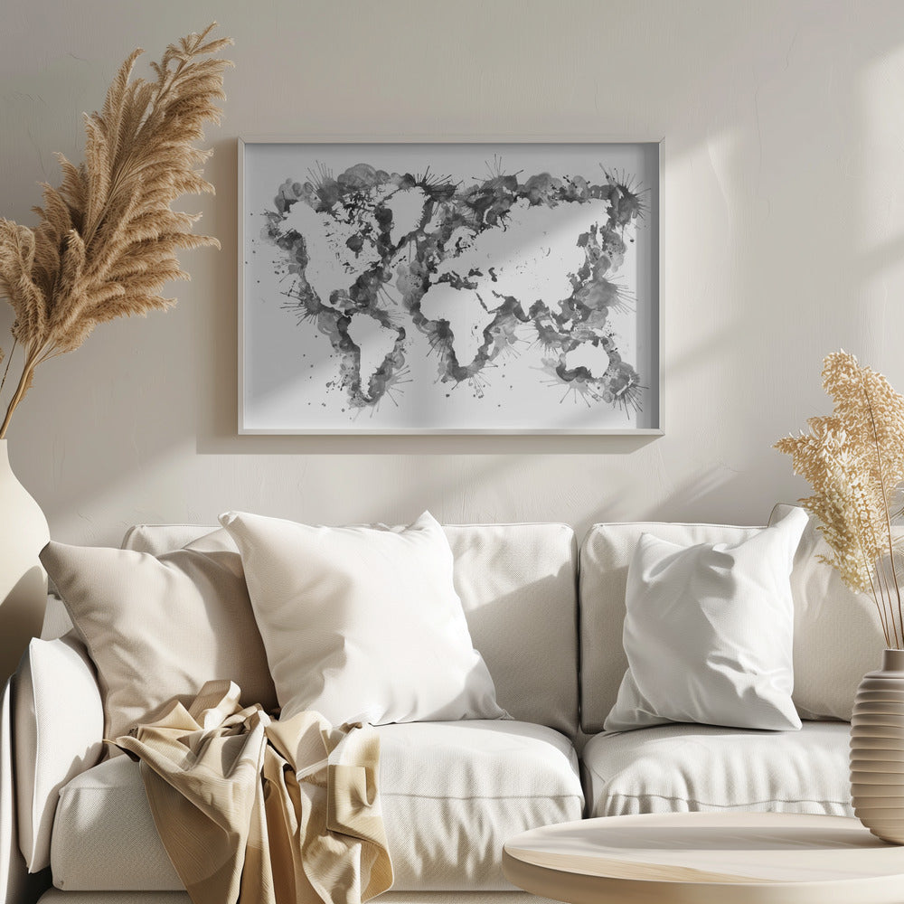 An abstract black and white world map created with ink splatters and watercolor washes on a white background, enclosed in a silver frame. The continents are formed by the negative space, outlined by the dynamic splatters of black and grey ink. Print