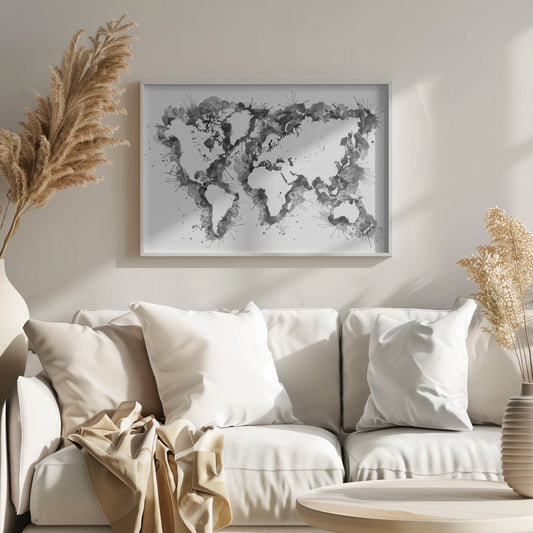An abstract black and white world map created with ink splatters and watercolor washes on a white background, enclosed in a silver frame. The continents are formed by the negative space, outlined by the dynamic splatters of black and grey ink. Print