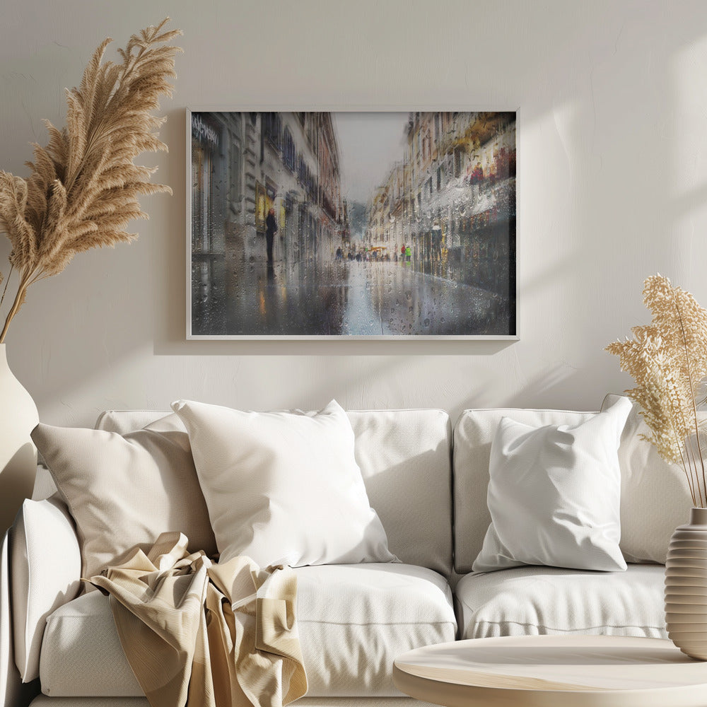 An impressionistic painting of a city street on a rainy day, viewed as if through a window covered in water droplets. The scene is blurred and atmospheric, with the wet pavement reflecting the muted colors of the buildings and distant figures. The artwork is presented in a silver frame. Decor