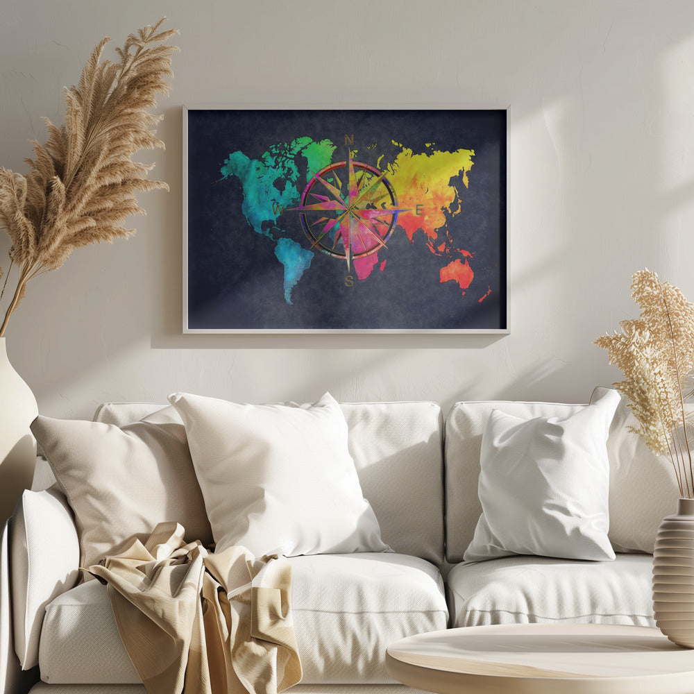 An artistic world map in a silver frame, featuring continents in a vibrant rainbow watercolor style against a dark, textured navy blue background. A large, ornate, and colorful compass rose is superimposed in the center of the map. Artwork